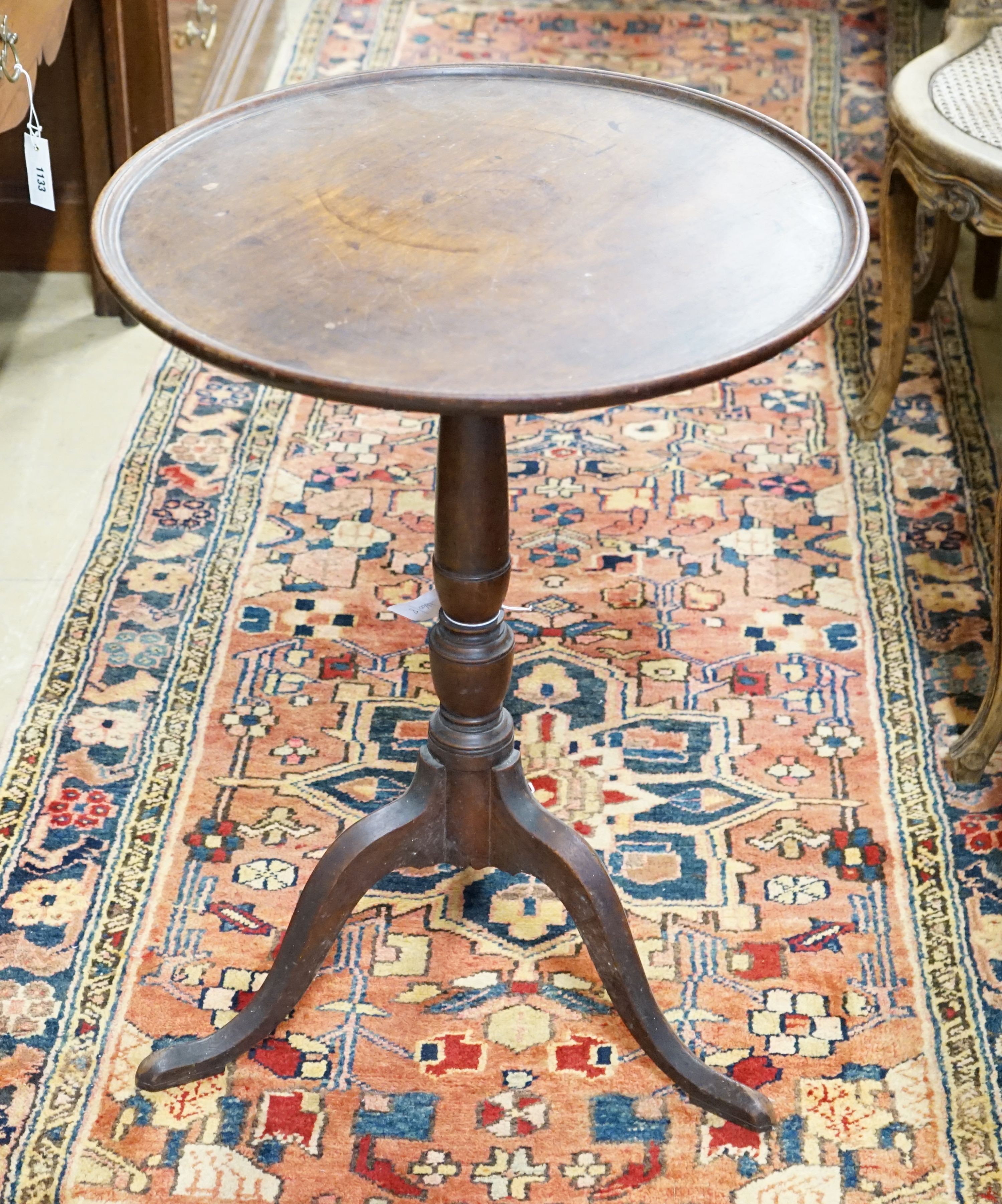 A George III mahogany tilt top tripod table, diameter 53cm, height 71cm (a.f.)